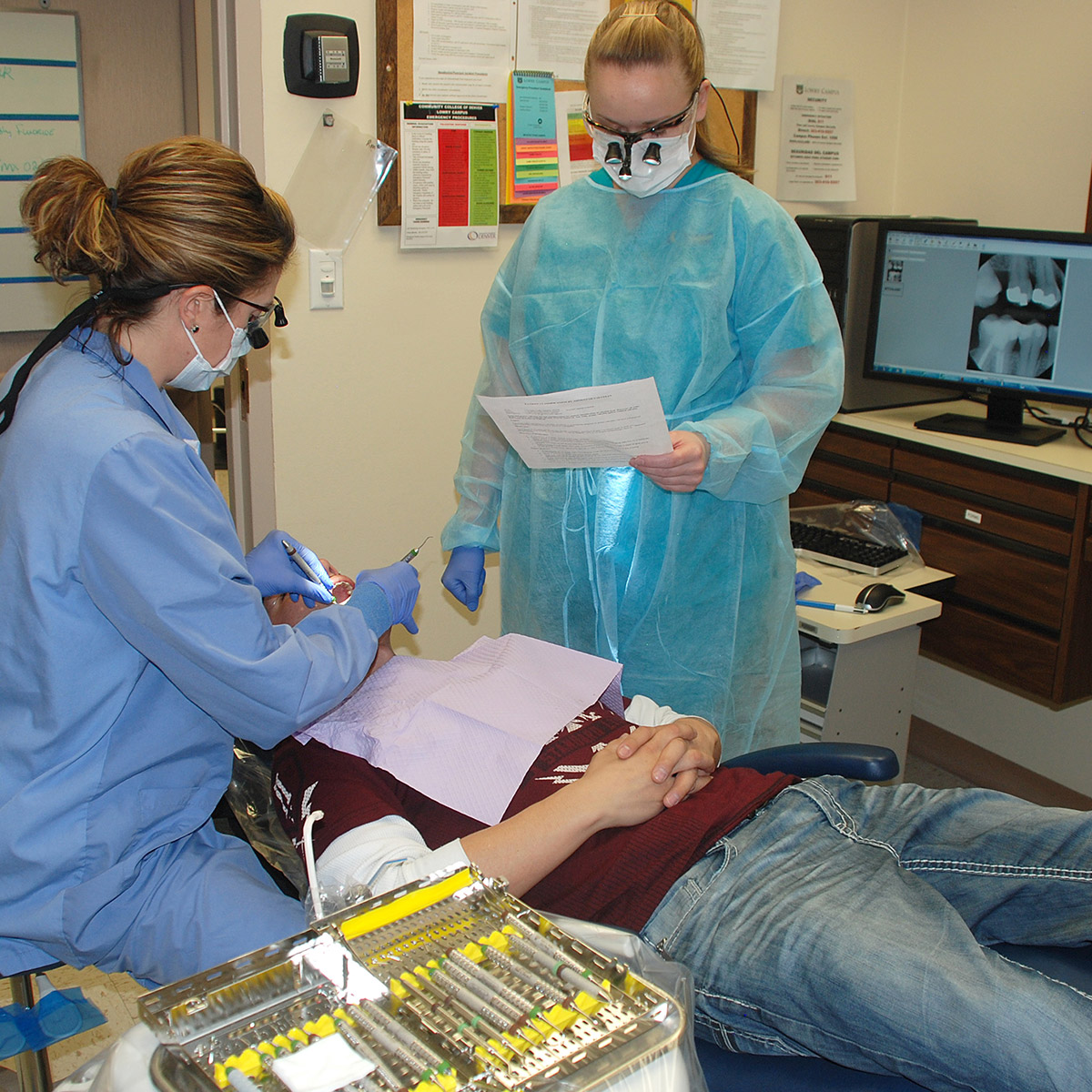 CCD Dental Hygiene students with a patient