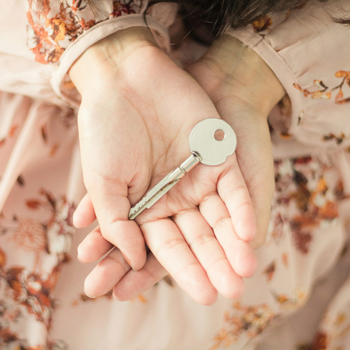 Female hands with key
