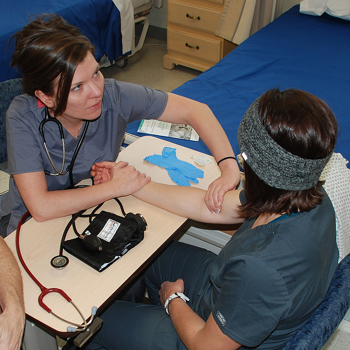 CCD Nurse Aide students testing blood pressure