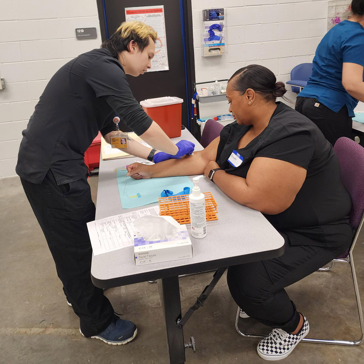 CCD phlebotomy students drawing blood
