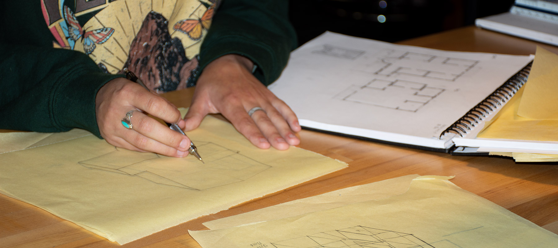 hands of a CCD Architectural Technologies student creating a floorplan