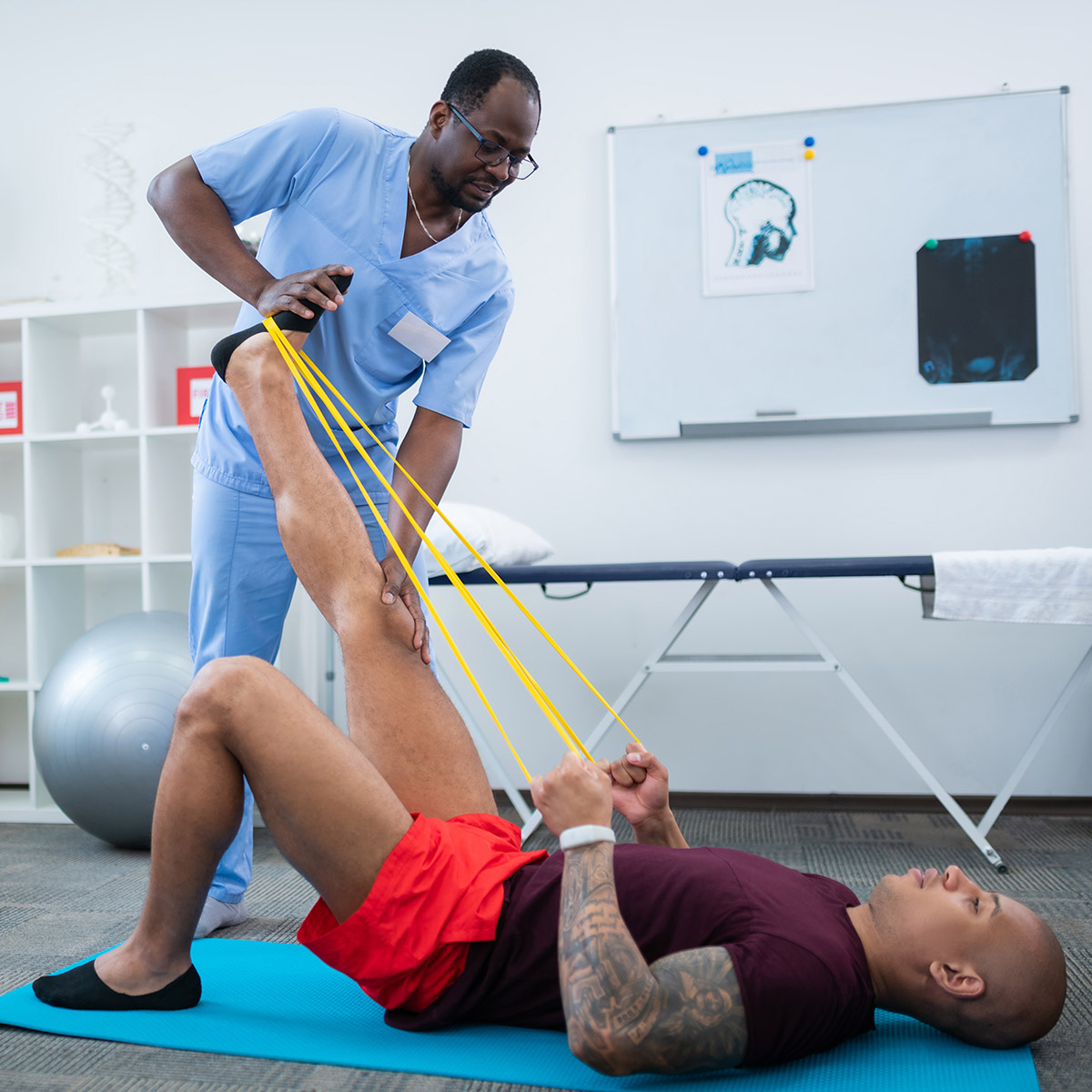 CCD Health and Exercise Science student helping a patient with exercises