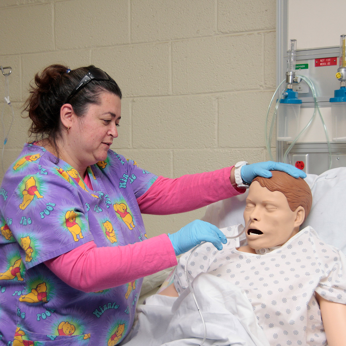 CCD Integrated Nursing Pathway student practicing with a medical dummy