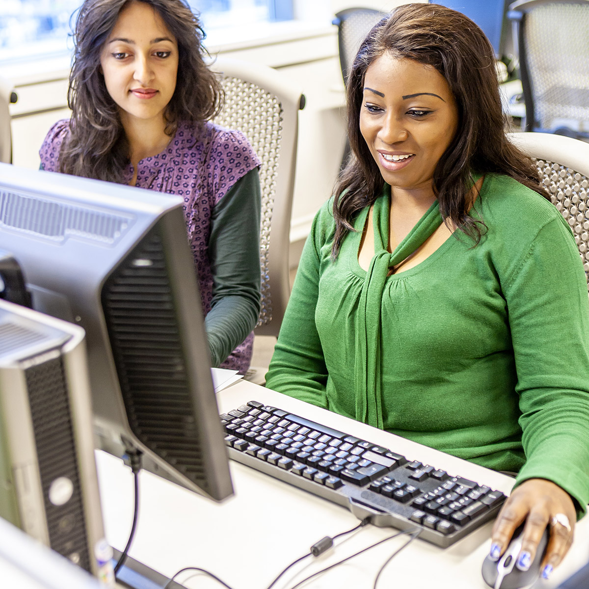 female CCD high school diploma students at a computer