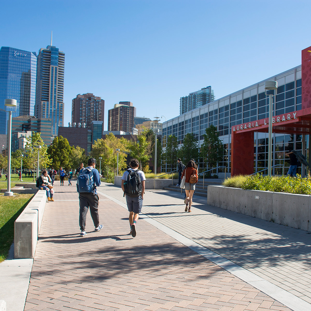 CCD students walking on sidewalk outside of Auraria Library