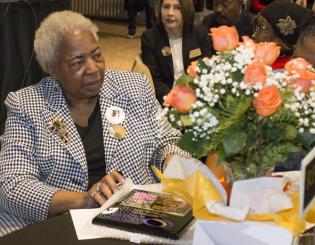 MLK Celebration 2020 woman sits with bouquet of flowers