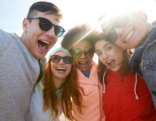 students smiling with sunglasses