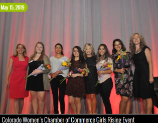 women holding flowers at a scholarship award event