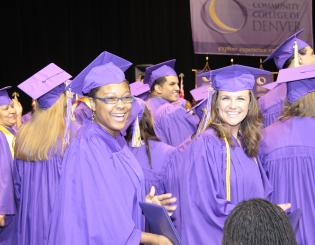 Group of CCD Graduates wearing purple graduation gowns at the 2014 Commencement Ceremony