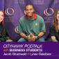 Woman with black and red hair, man in red and green polo, woman with brown hair smiling. CITYHAWK PODTALK with BUSINESS STUDENTS Jacob Gruenwald & Lynae Casebeer