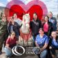 Vet Tech Students posing with a white horse. CCD logo. Heart around horse.
